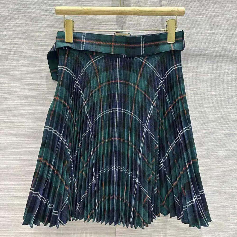 Side angle showing silhouette of Burberry Women Pleated Panel Check Wool Belted Kilt