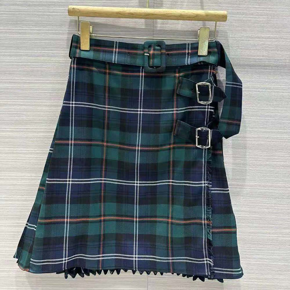 Close-up of pleated panel and belted waist on Burberry kilt