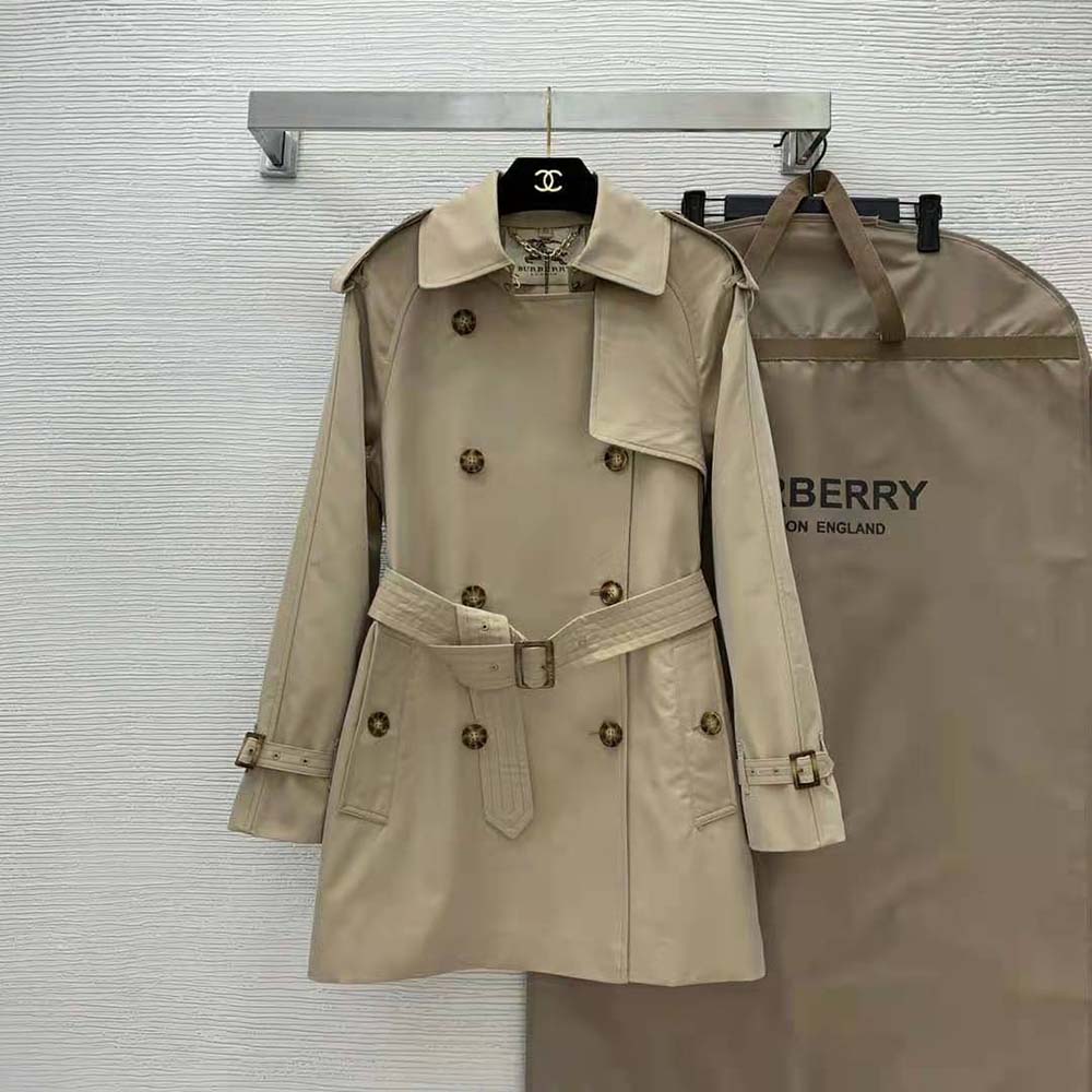 Side angle showing slim tailored silhouette of Burberry Kensington trench