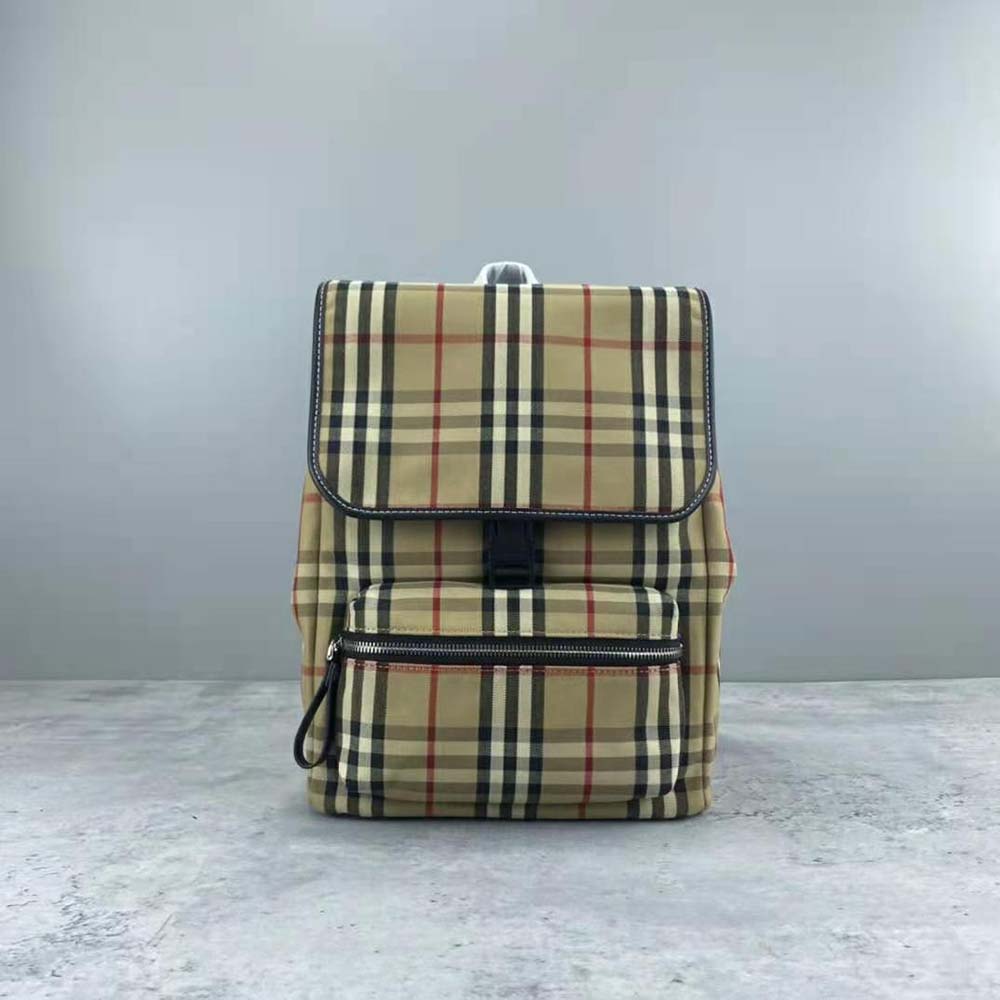 Close-up of vintage check pattern and leather trim on Burberry backpack