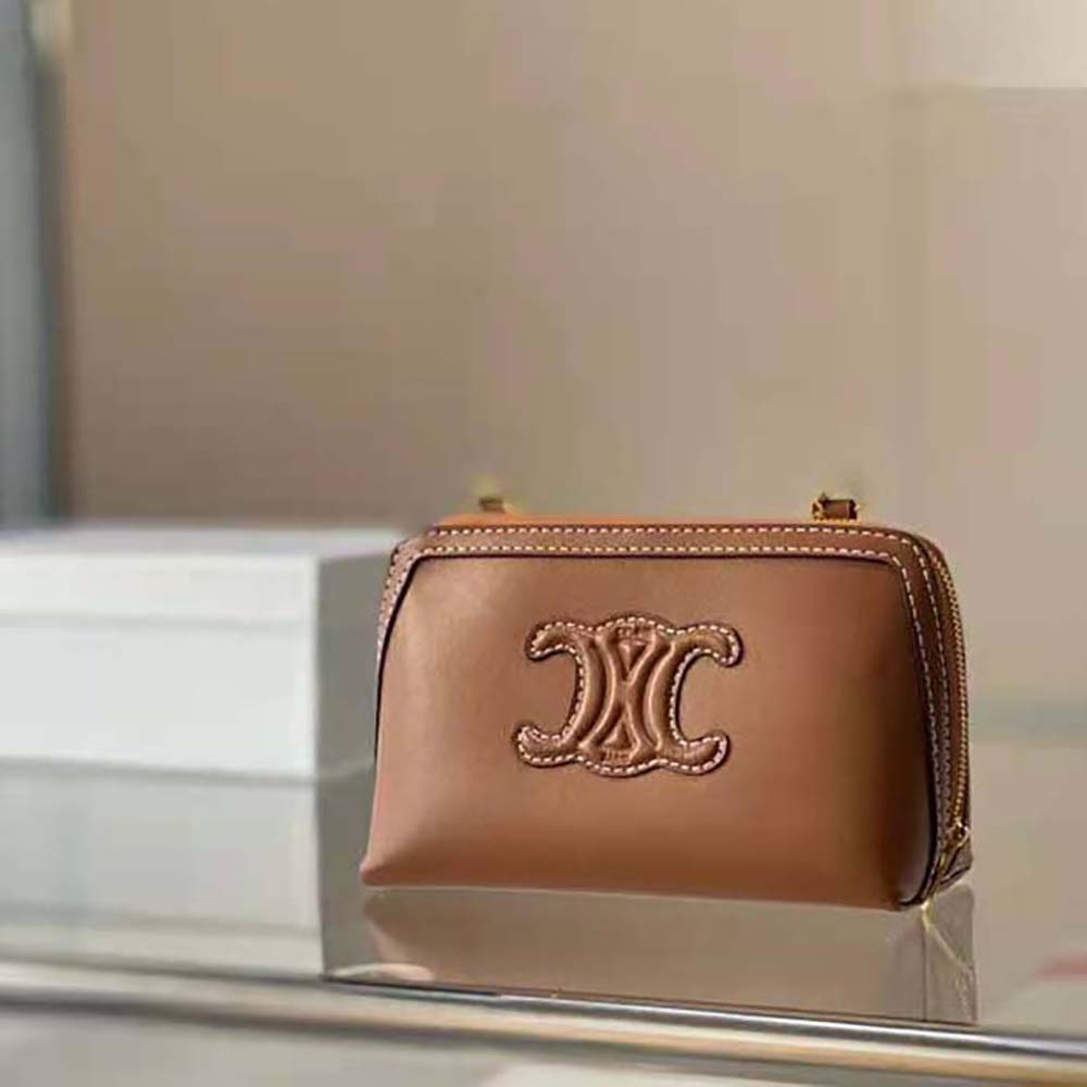 Side angle showing compact silhouette of Celine Women Clutch on Chain Cuir Triomphe