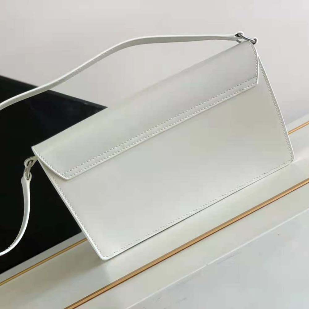 Side angle showing trapeze silhouette of Celine Women Trapeze Triomphe Bag