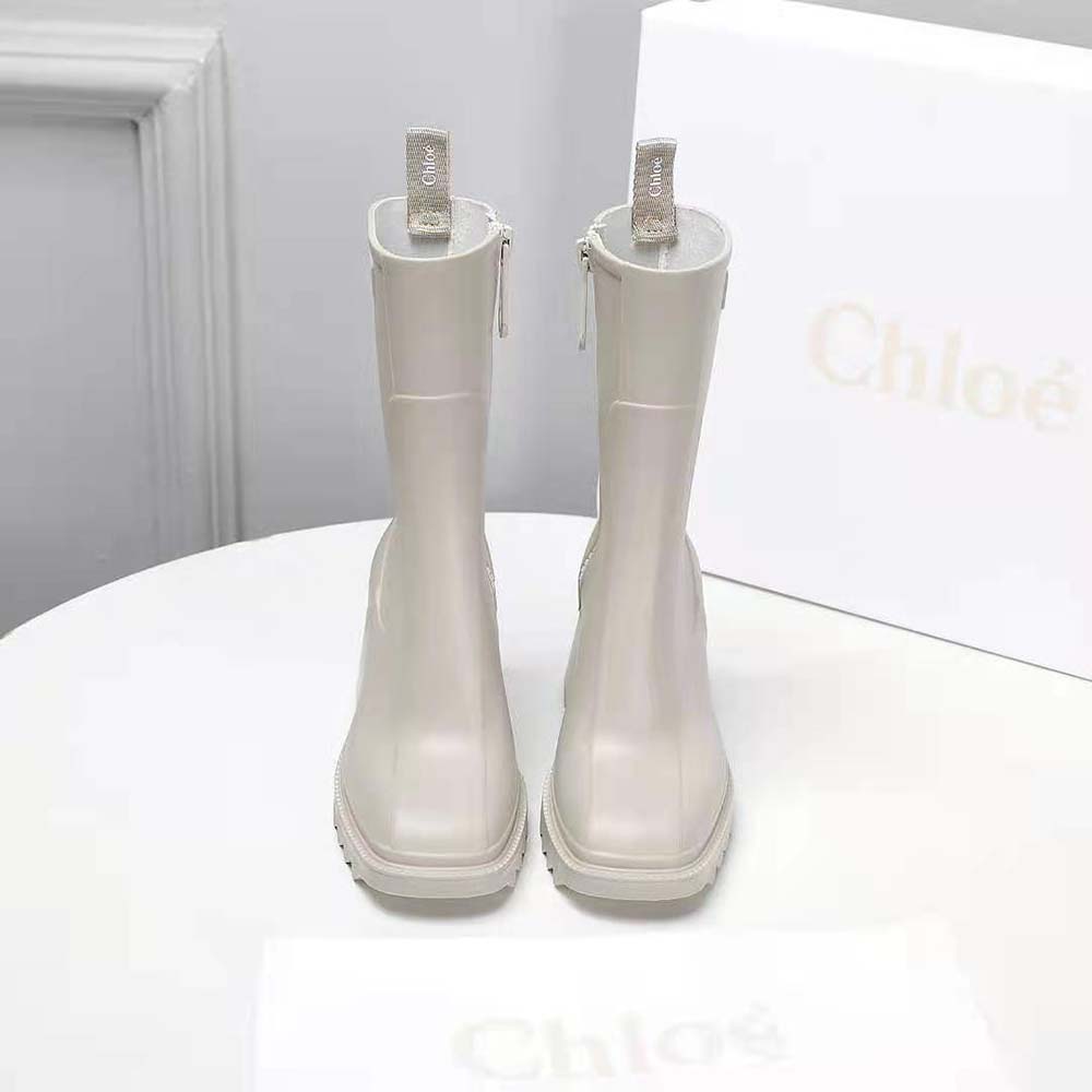 Close-up of elastic gusset and embossed logo on Chloe Women Betty Rain Boot