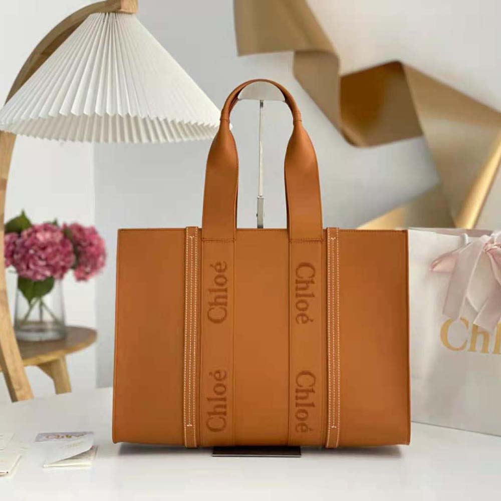 Close-up of gold hardware and leather texture on Chloe Women Large Woody Tote Bag-Brown