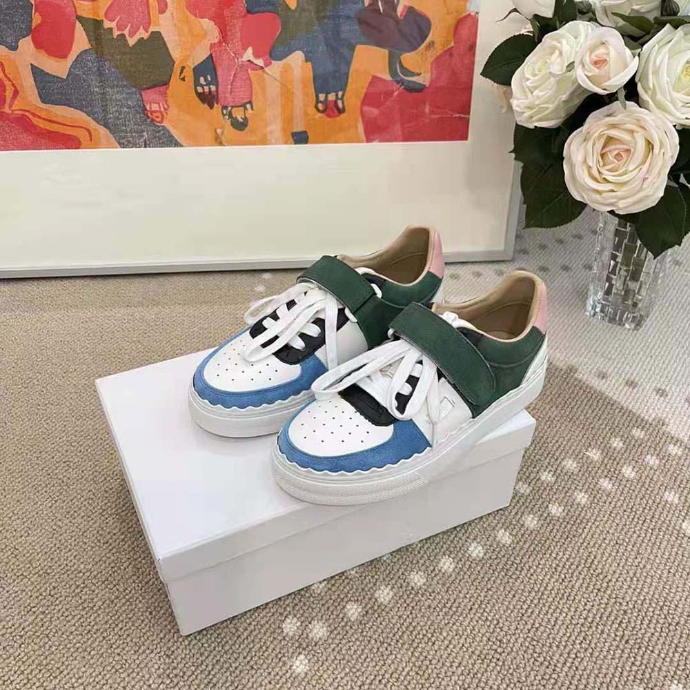 Top-down view of Chloe Women Lauren Sneaker with Strap-Blue highlighting leather texture