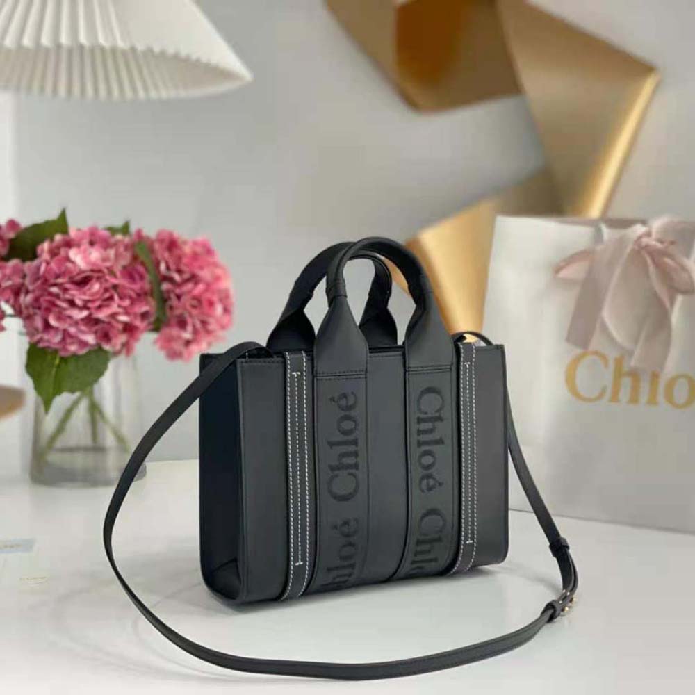 Side profile showing compact silhouette of Chloe Women Mini Woody Tote Bag-Black