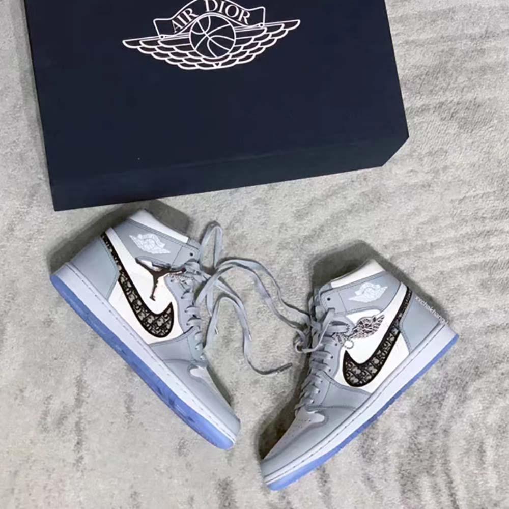 Close-up of smooth calfskin and Dior logo hardware on sneaker