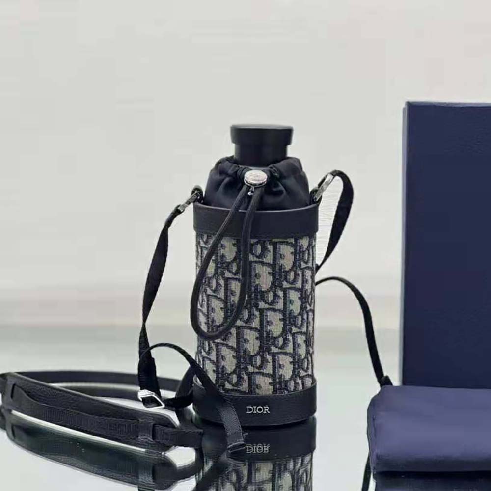 Close-up of signature Dior engraved hardware on bottle holder