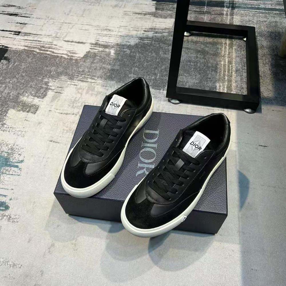 Close-up on Dior logo hardware on black B101 sneaker