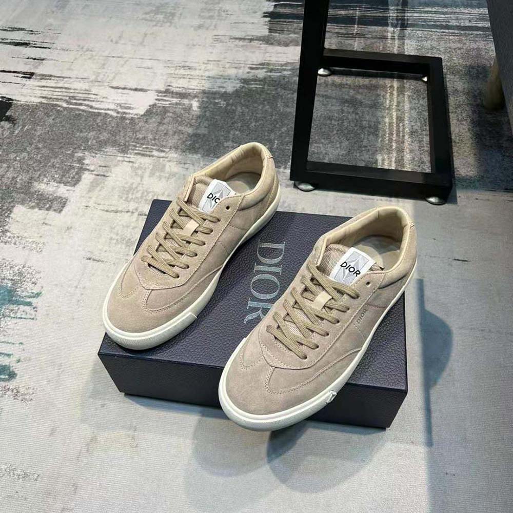 Close-up of embossed Dior logo on the blue nubuck calfskin sneaker
