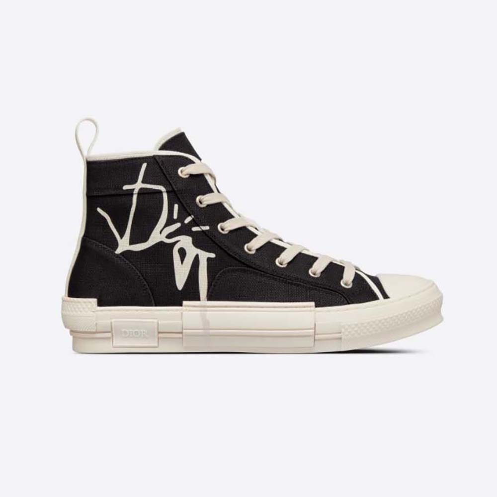 Front angle of Dior Men B23 Cactus Jack Dior High-Top Sneaker Black and Cream Cotton Canvas
