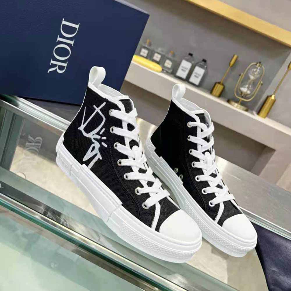 Close-up detail of Dior and Cactus Jack branding on sneaker side