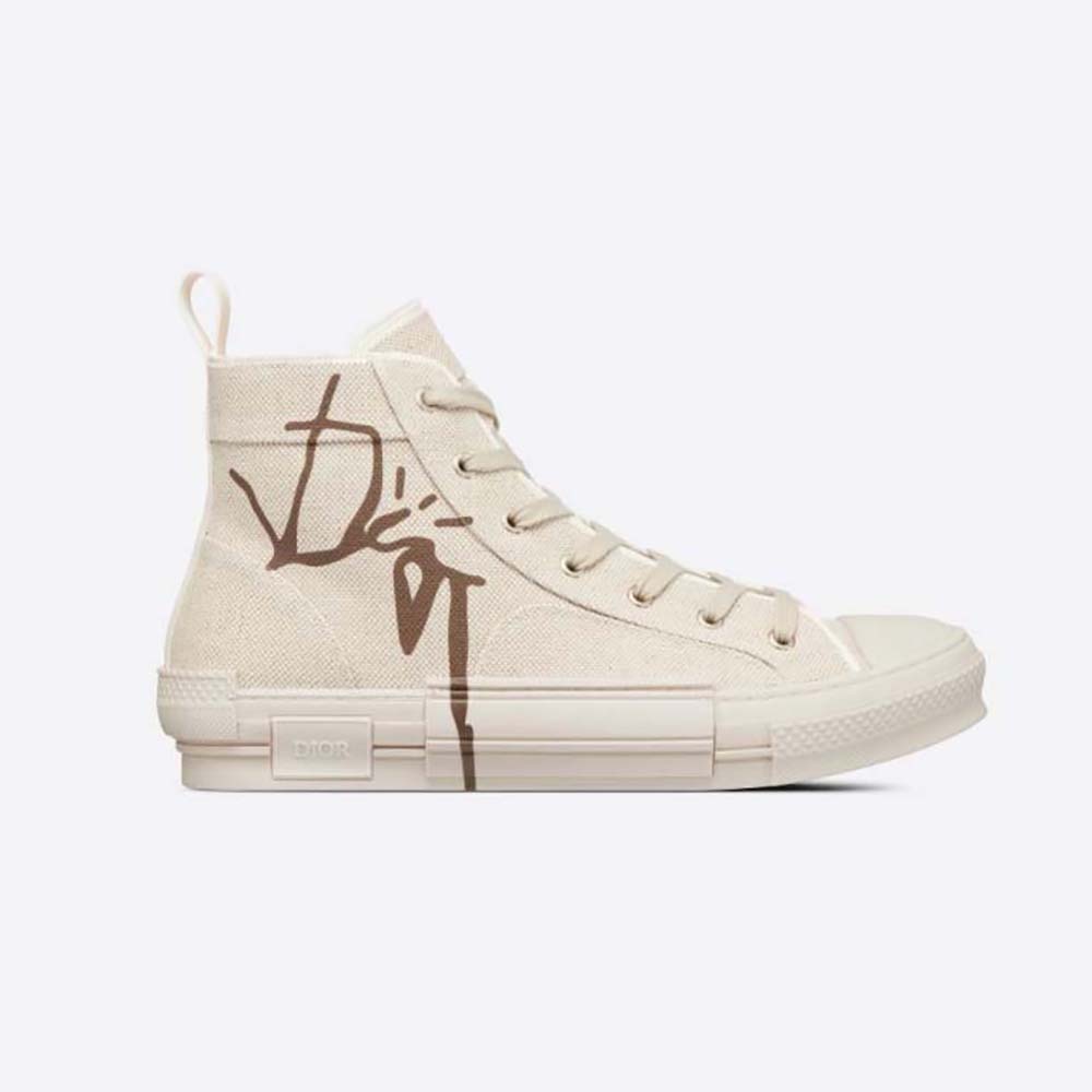Side profile of Dior Men B23 Cactus Jack Dior High-Top Sneaker in beige