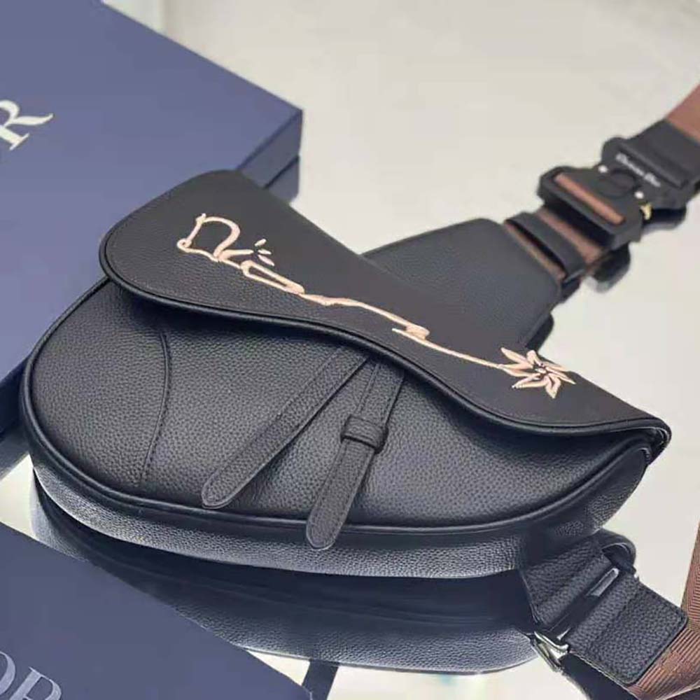 Side angle showing silver-tone hardware on Dior Men Cactus Jack Shoulder Bag