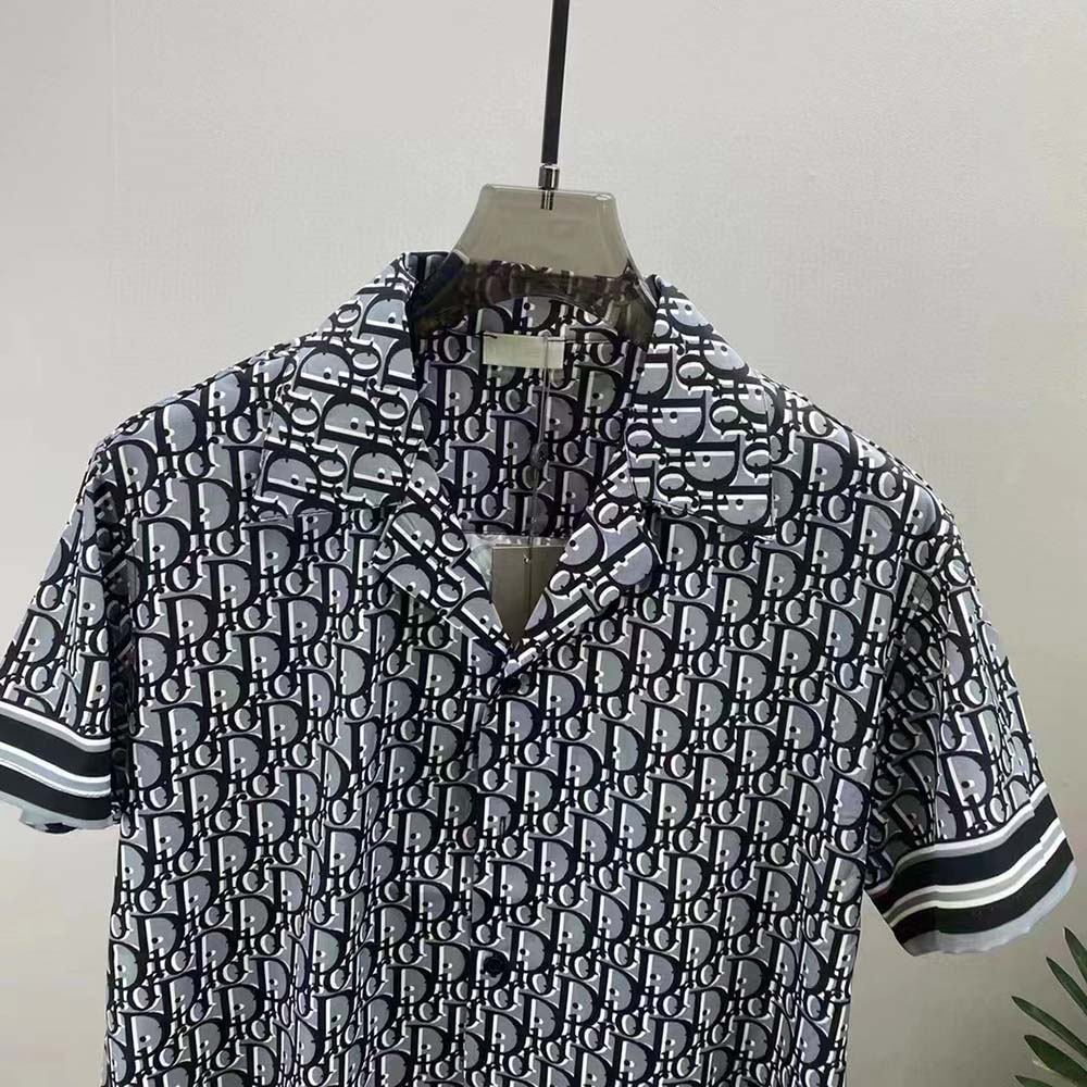 Side angle showing relaxed fit of Dior Men Chez Moi Blue Dior Oblique shirt