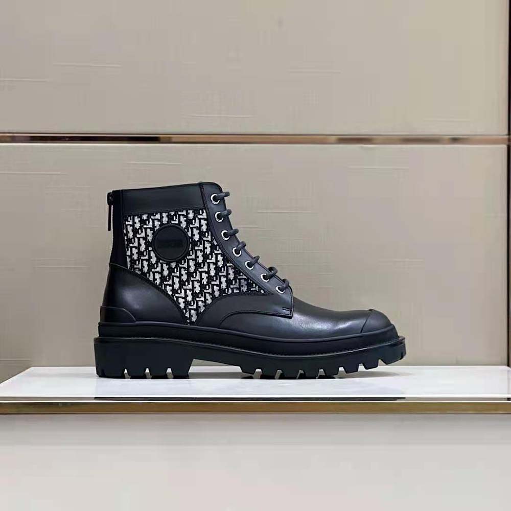 Close-up on beige and black Dior Oblique jacquard detail on boot