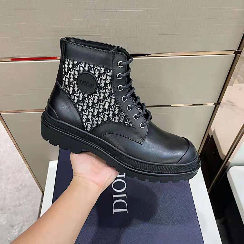 Top angle showing zip closure and black matte hardware on boot