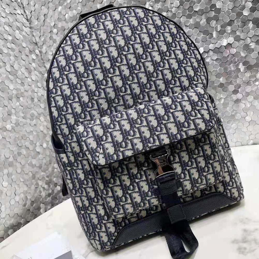 Side angle showing adjustable straps on Dior Men Explorer Backpack