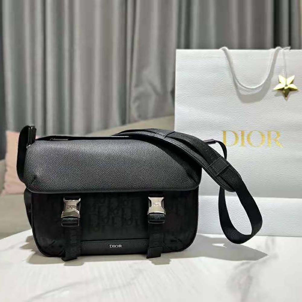 Close-up of flap and silver hardware on Dior Men Explorer Messenger Bag