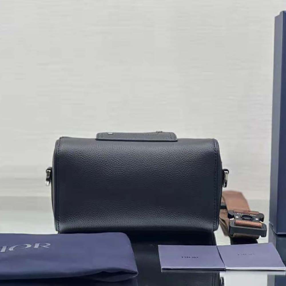 Side angle showing silver hardware and leather texture on Dior Men Lingot 22 bag