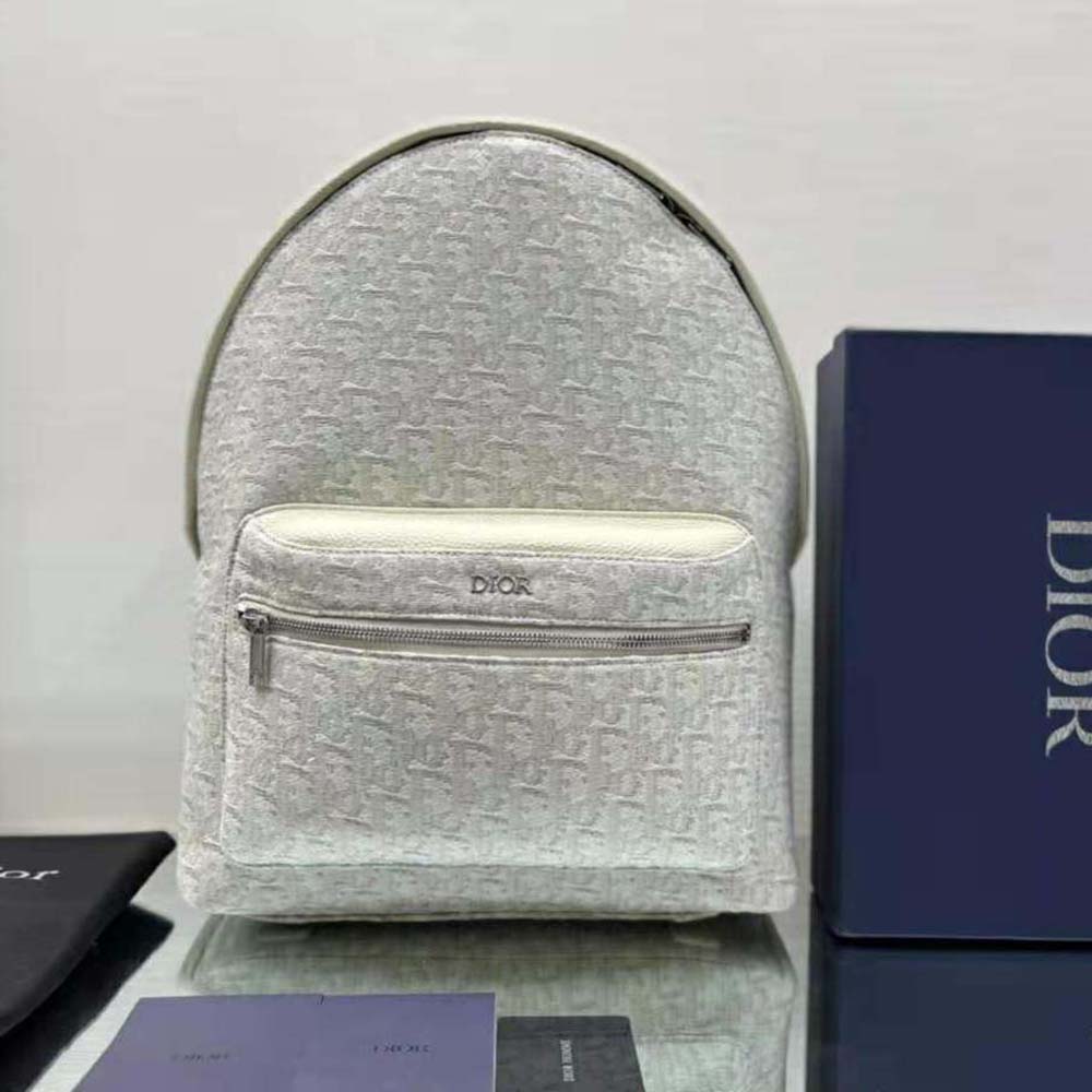 Close-up of silver hardware on Dior Men Rider Backpack Beige Dior Oblique Jacquard