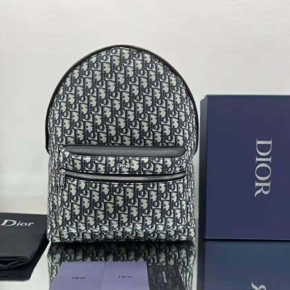 Close-up of black leather trim and silver hardware on Dior Men Rider Backpack
