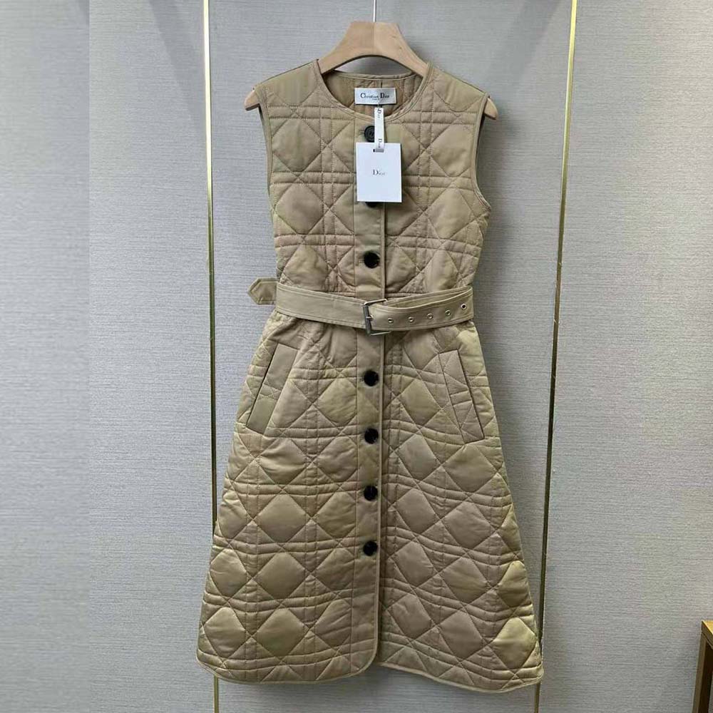 Close-up of Dior macrocannage motif hardware on trench coat