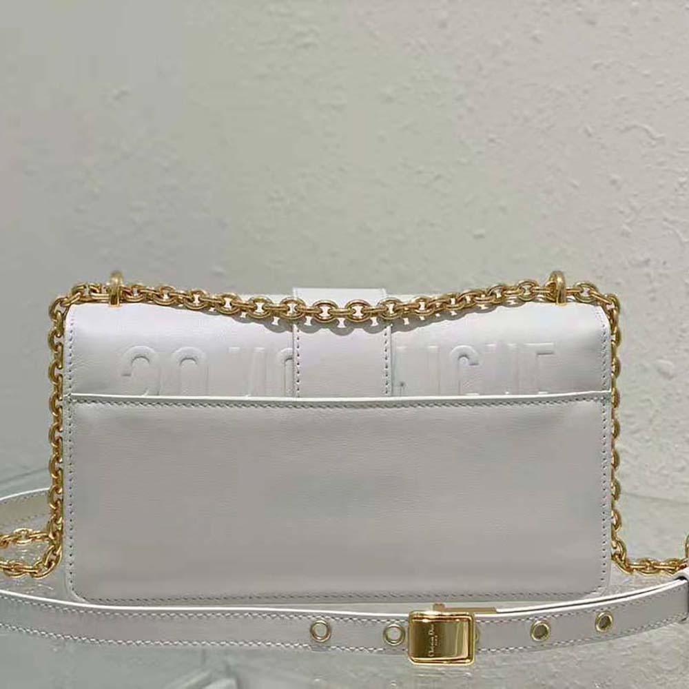 Side profile highlighting smooth white calfskin of Dior Women 30 Montaigne East-West Bag