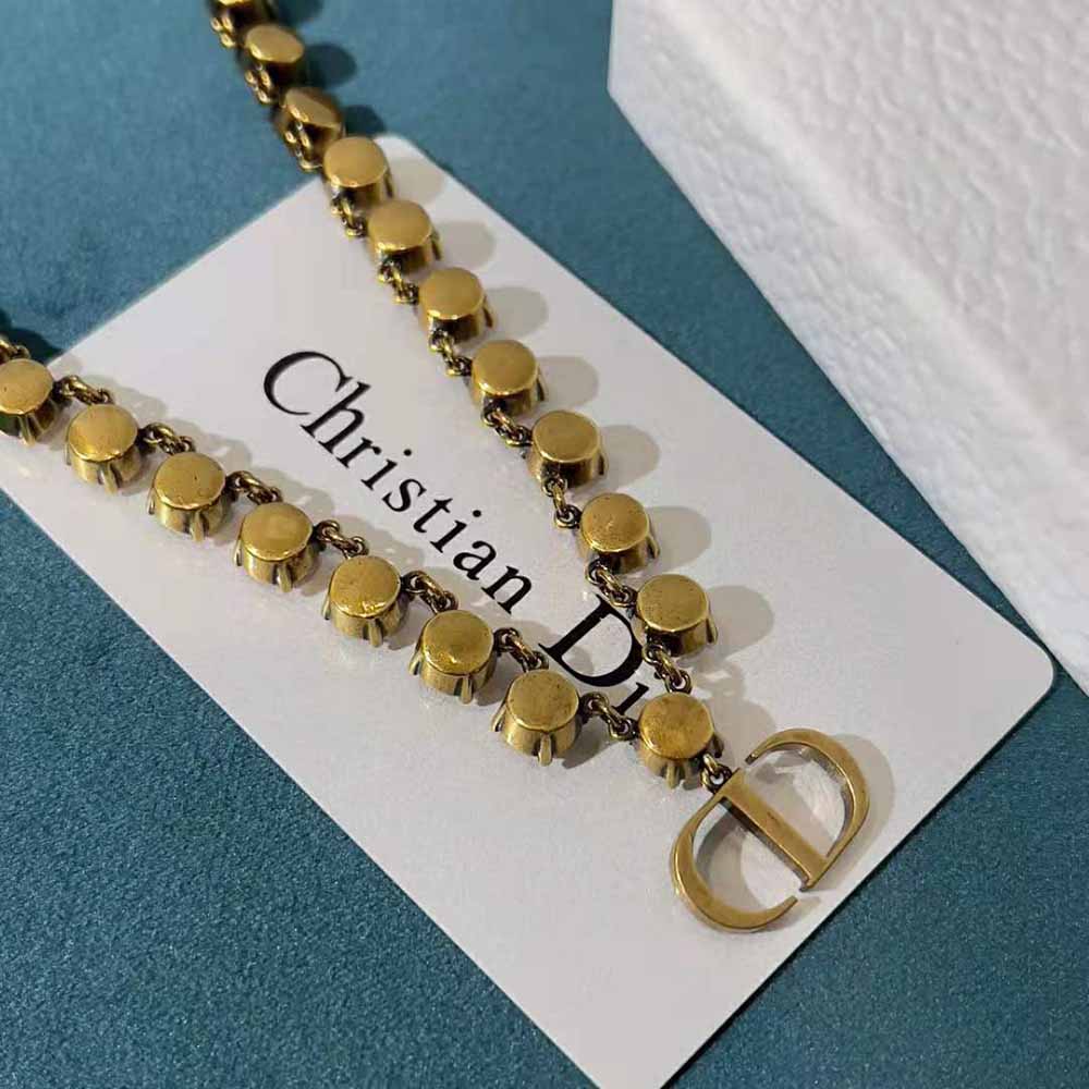 Side profile showcasing pendant and chain of Dior Women 30 Montaigne Necklace