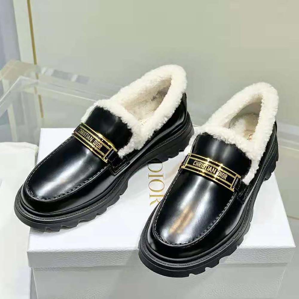 Side profile showing white shearling lining in Dior Women Code Loafer