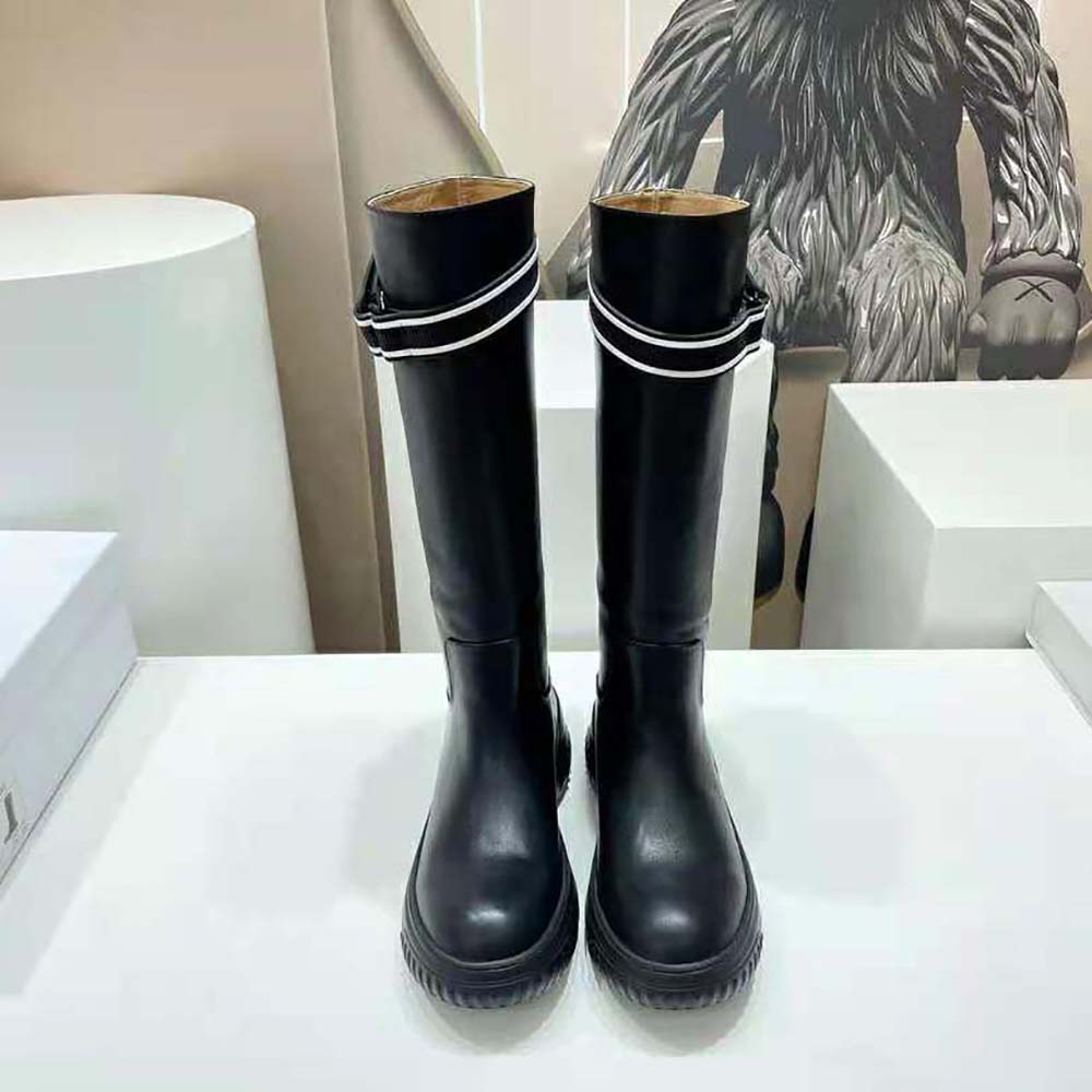 Close-up of black calfskin and Dior engraved hardware on D-Racer Boot