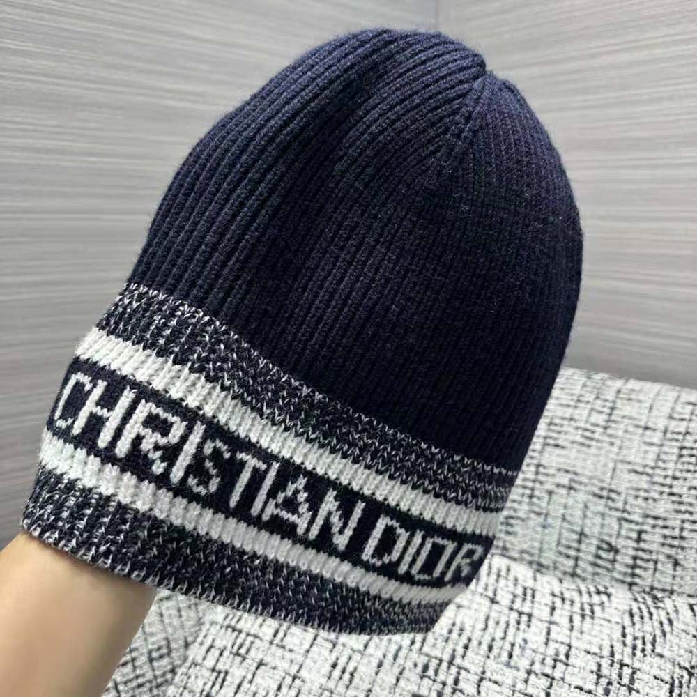 Close-up detail of Dior logo embroidery on blue D-White Beanie