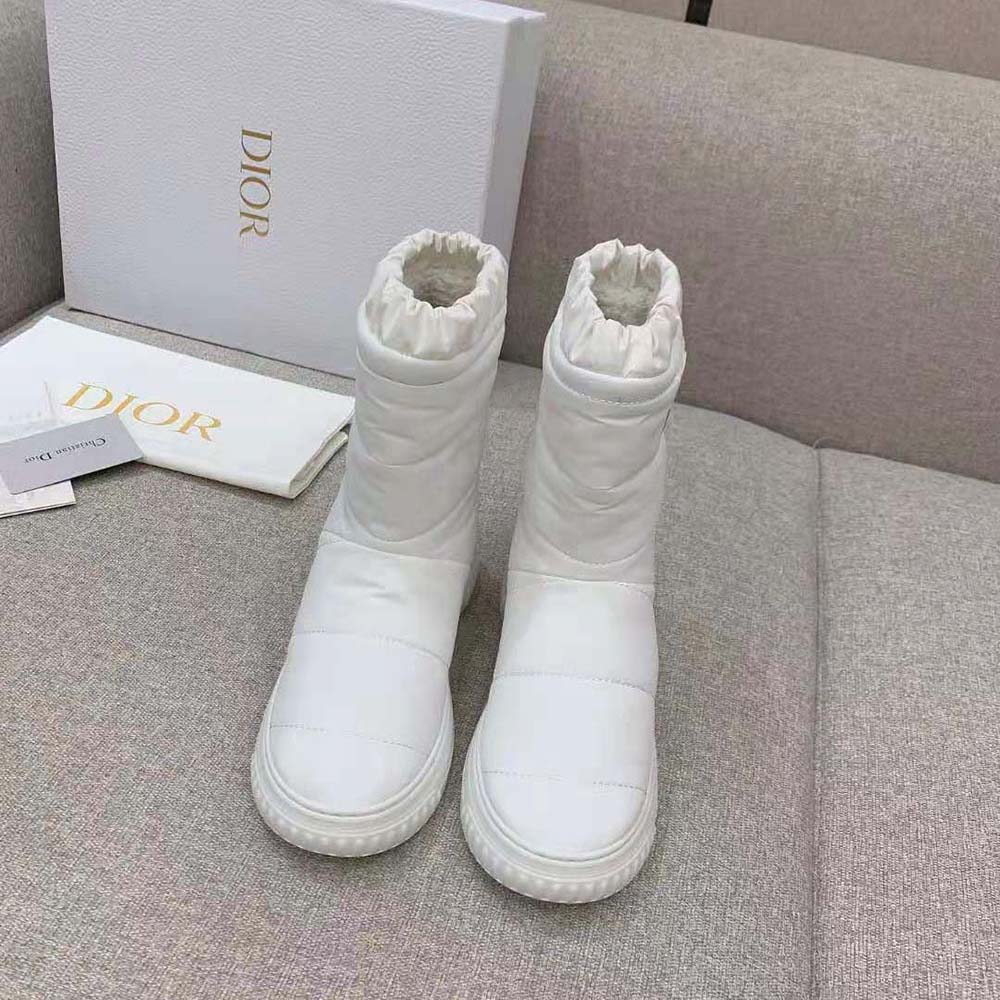 Close-up detail of silver Dior hardware on Frost Ankle Boot in white