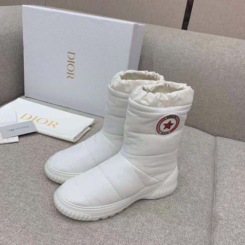 Side profile showing silhouette and shearling lining of Dior Frost Ankle Boot