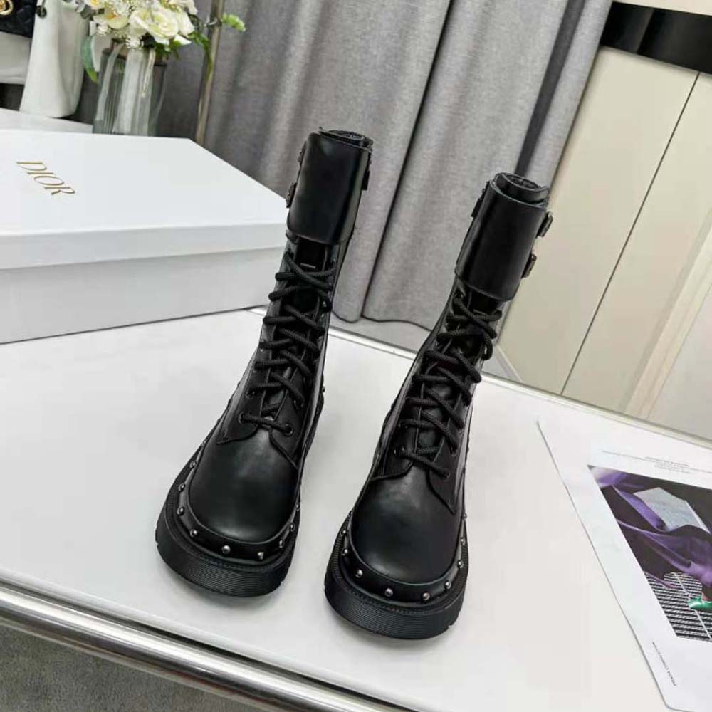 Close-up of metallic hardware on Dior Women Diorquake Ankle Boot