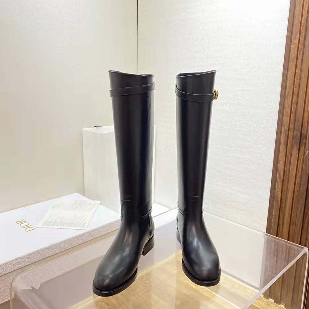 Close-up of embossed Dior detail on the black calfskin boot