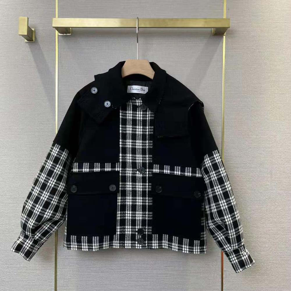 Close-up of signature Dior buttons on the peacoat hooded coat