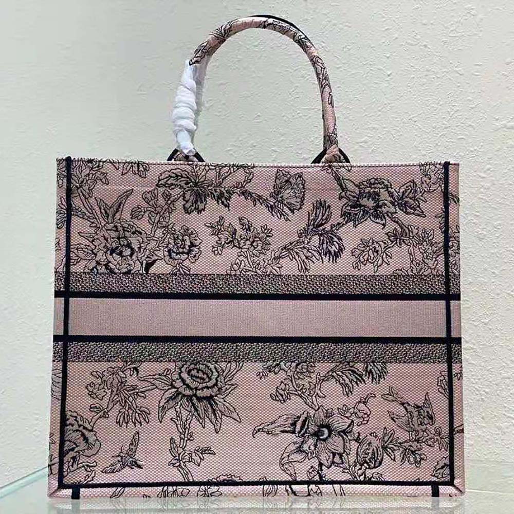 Side profile showing silver hardware on Dior Women Large Dior Book Tote Powder Pink