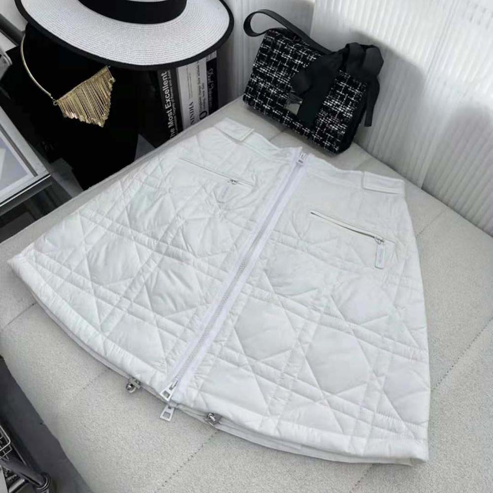 Close-up of quilted Macrocannage detail on Dior white miniskirt