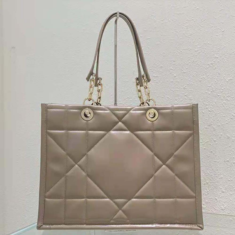 Close-up of sandy Archicannage stitching on Dior Women Medium Dior Essential Tote Bag