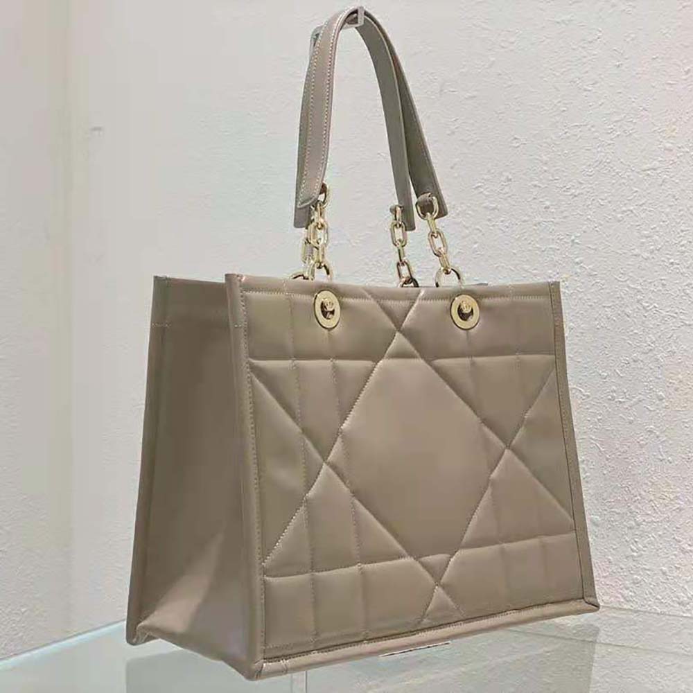 Side angle showing gold-tone hardware on Dior Women Medium Dior Essential Tote Bag