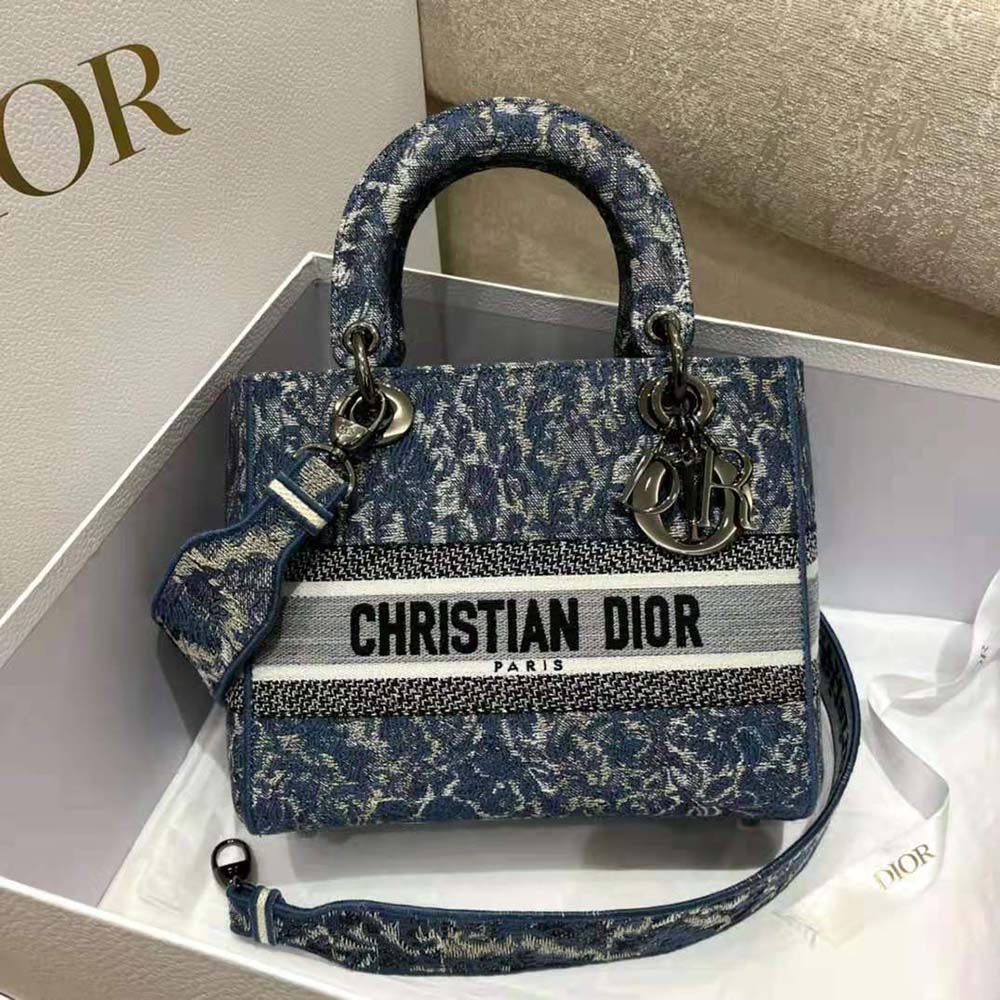 Close-up of embroidered blue brocart denim on Dior Women Medium Lady D-Lite Bag
