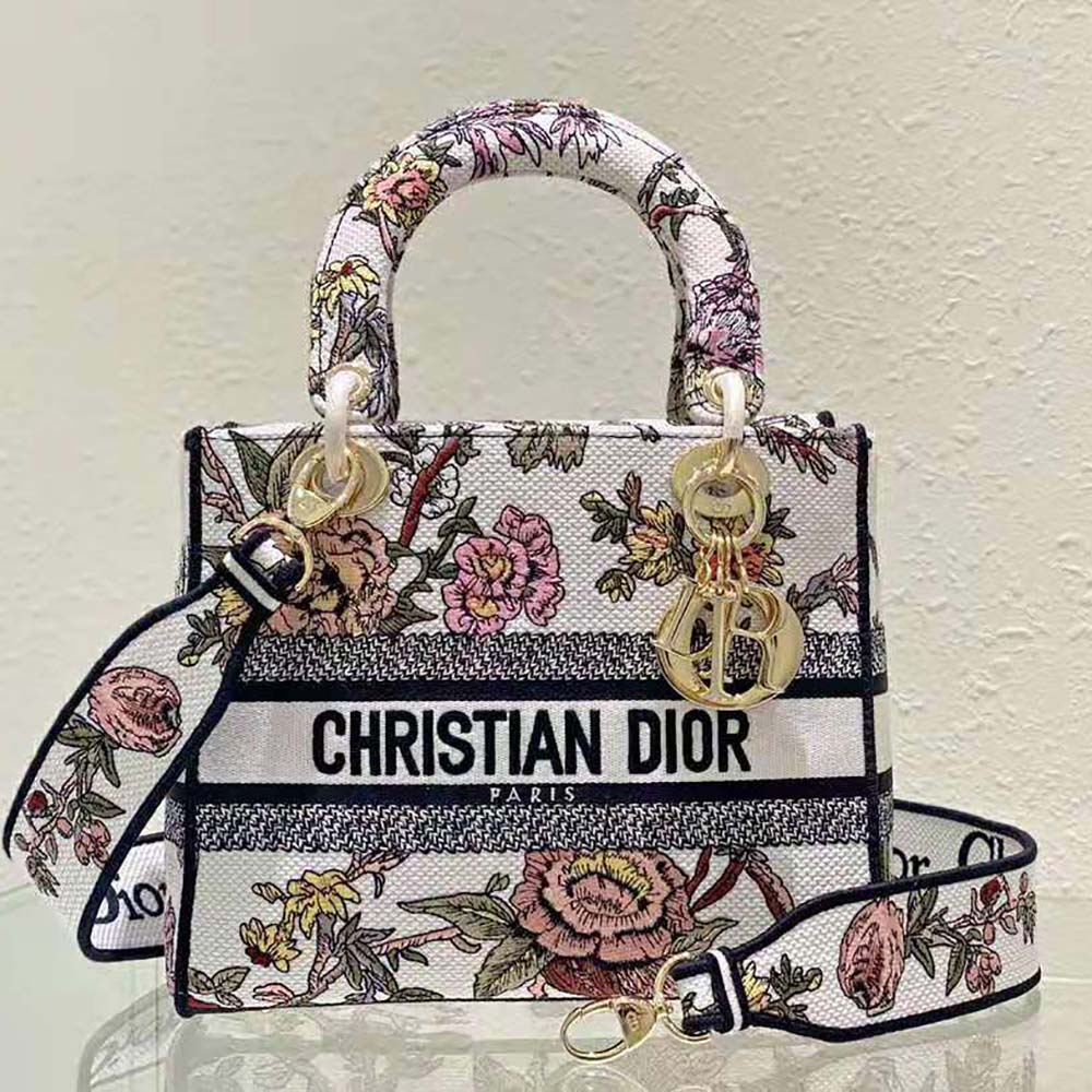 Close-up of Dior Jardin Botanique multicolor embroidery on white canvas bag