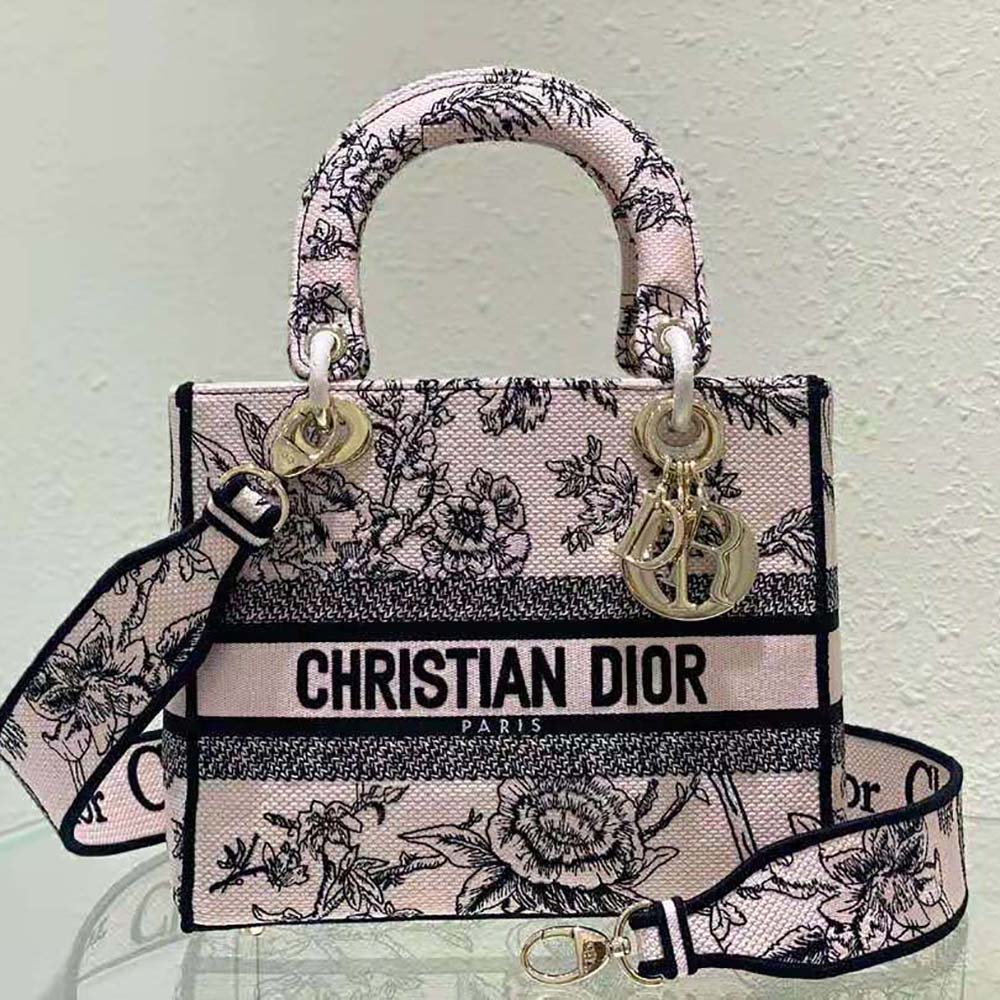 Side profile showing silver-tone hardware and strap of Dior Women Medium Lady D-lite Bag