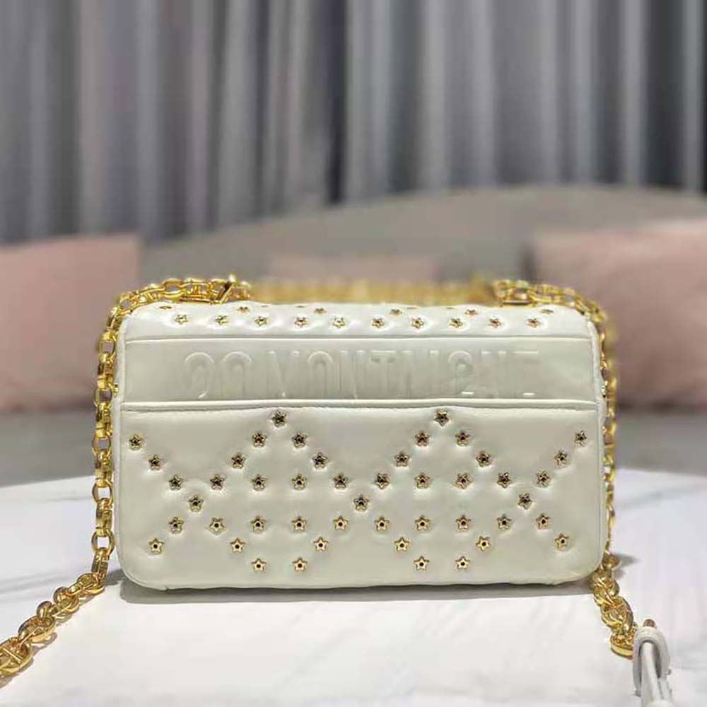 Side angle showing white lambskin texture on Dior Small Dior Caro Bag