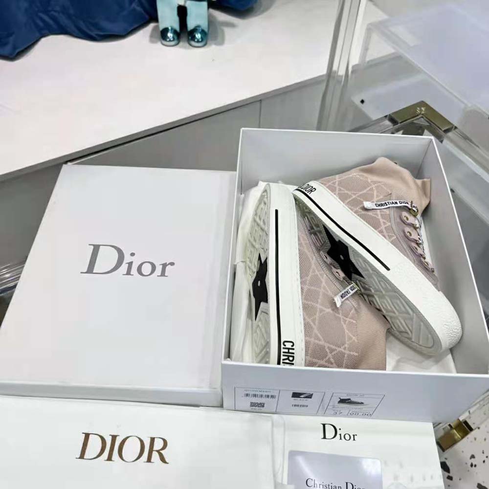Top-down angle showing pink mesh textile and Macrocannage pattern on Dior Women Walk’N’Dior