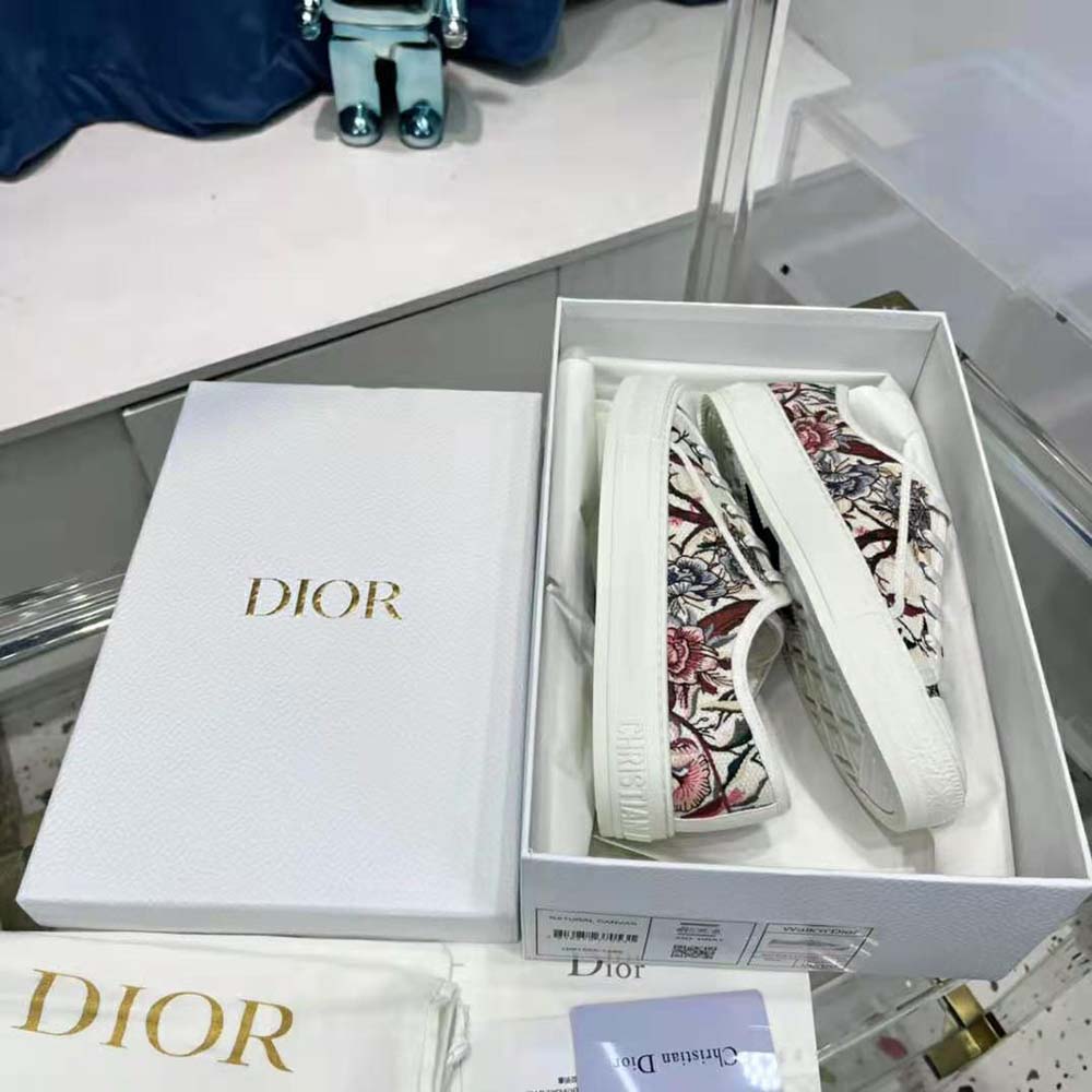 Overhead shot showing white cotton upper and lace-up closure of Dior Women Walk’N’Dior Sneaker