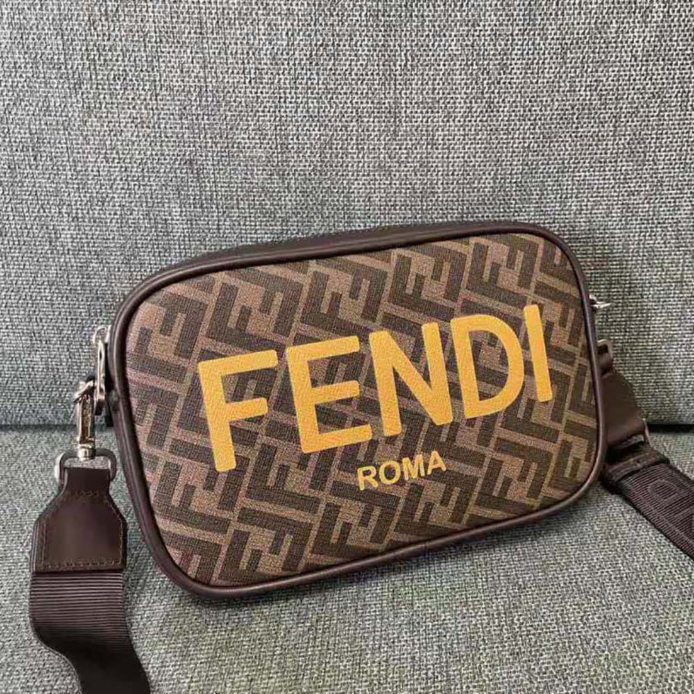 Close-up of gold hardware and brown jacquard fabric on Fendi Men Camera Case