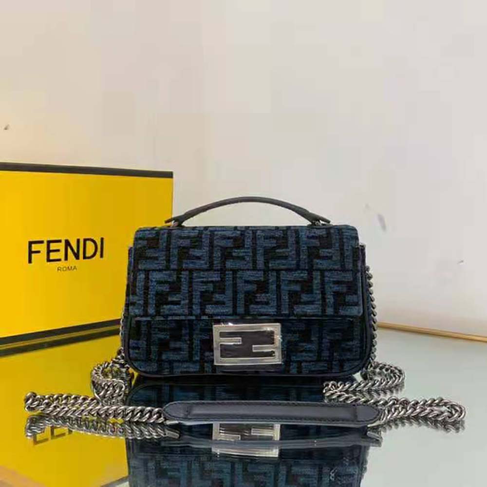 Close-up of gold chain strap and magnetic closure on Fendi bag