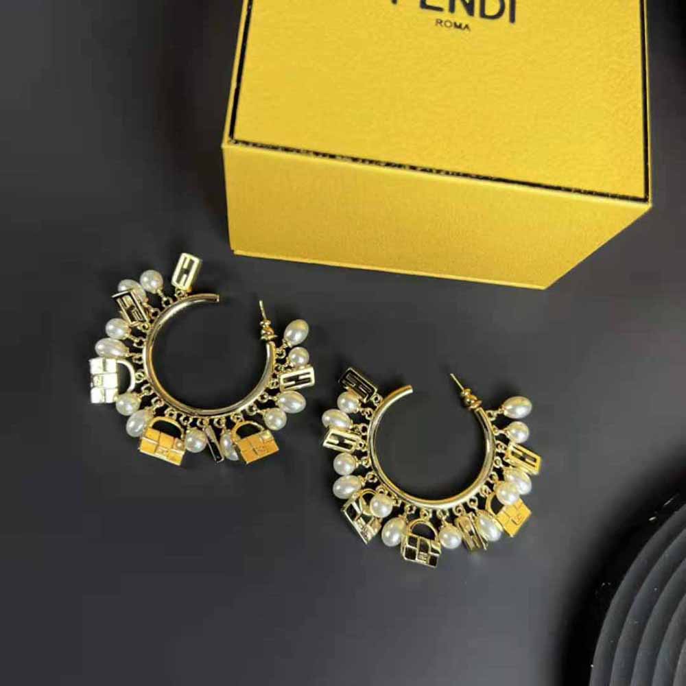 Side angle highlighting push-back closure of Fendi Women Baguette Earrings Gold-colored